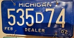February 2002 United States Michigan Base Dealer License Plate Tag. Fixed Price $13.00.