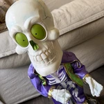 Gemmy Vintage Purple Dancing Lighted Super Freak Skeleton Head Moves /lights. Fixed Price $75.00.